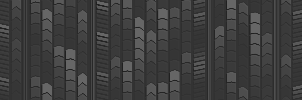 Stacked chevron pattern in dark grey on a black background